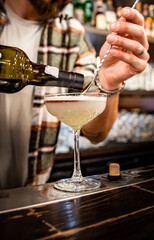 man hand bartender making cocktail on the bar counter