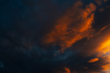 Fototapeta na wymiar Natural landscape of dark cloudy sky at sunset.