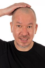 Do It Yourself Pandemic Haircut for Man: A Man Looking Surprised After Shaving Off His Head
