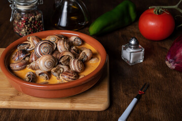 Snail stew, dish based on a sauce of vegetables and cooked snails.