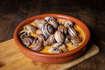 Snail stew, dish based on a sauce of vegetables and cooked snails.