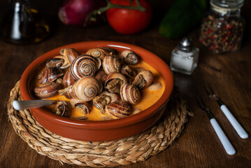 Snail stew, dish based on a sauce of vegetables and cooked snails.