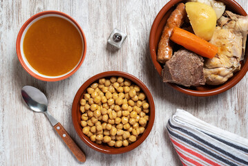 Cocido Madrileño, stew of chickpeas, vegetables, beef, chicken, chorizo and bacon typical of...