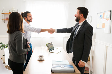 Young man and woman making a business deal