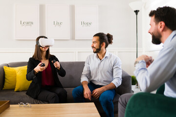 Beautiful couple using VR glasses for a house tour