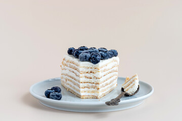 One piece of vanilla crepe cake with blueberries