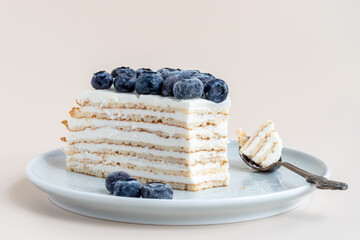 One piece of healthy gluten free pancake cake with ricotta and blueberries