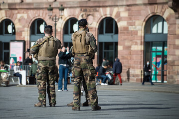 Strasbourg - France - 19 February 2022 - Portrait on back view of french military patroll in the street - 488375344