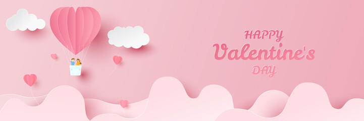 Happy valentines day. Heart balloons with young couple on flying over clouds. Paper cut and craft style illustration