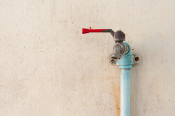 old water valve on the wall 