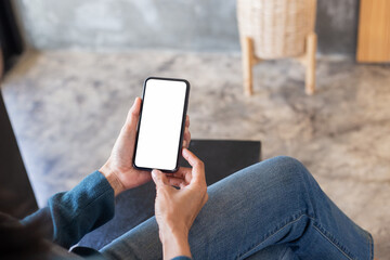 cell phone blank white screen mockup.hand holding texting using mobile on desk at office.background empty space for advertise.work people contact marketing business,technology