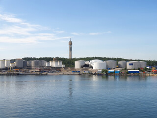 Fototapeta na wymiar Old oil harbor under construction with tv tower Kaknästornet visible in Stockholm Sweden