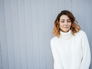 Serene young woman taking quality time to relax