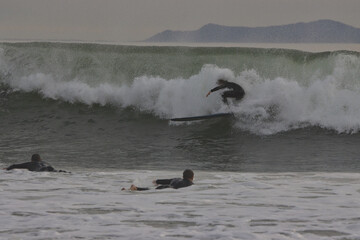 Surfing winter waves at Rincon point in California