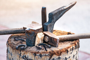 blacksmith's tools on an aspen stump