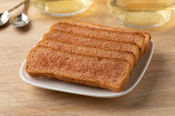 Dish with Dutch fresh traditional cinnamon biscuits close up 