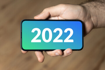 2022 - hand holding a phone