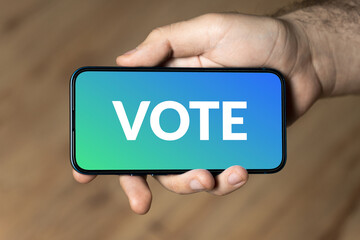 Vote - hand holding a phone