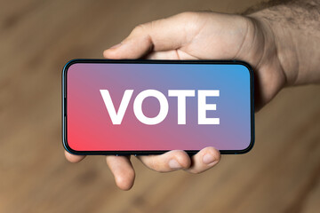 Vote - hand holding a phone