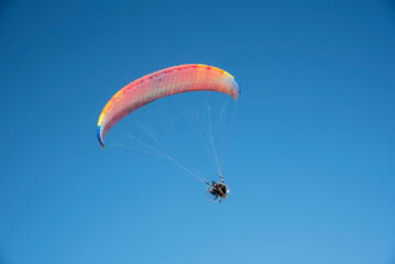 Motorized paragliders flying over the coast