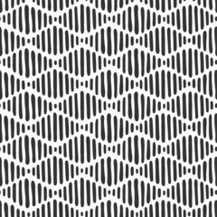 Abstract hand drawn seamless vector pattern with dashed lines, stripes. Striped texture. Simple repeating ornament with lines. Black and white doodle pattern background.