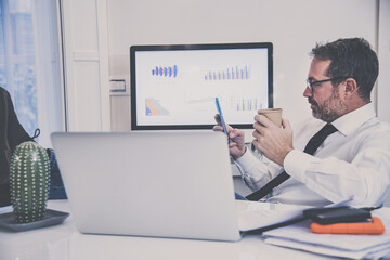 Business man working with laptop sitting at the desk. Male works at computer communicate online with remote office. Health care quarantine lifestyle, home working, homeschooling new technology concept