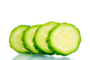 Four slices of ripe green cucumber , macro, isolated on white background.