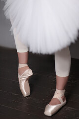 ballerina on pointe shoes in motion with a tutu