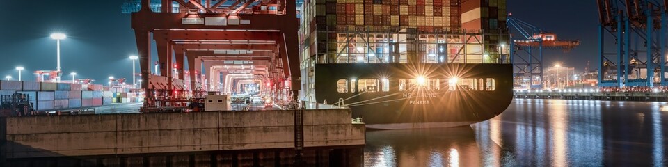 Panorama of a container terminal at night 