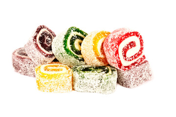 Heap of colorful Turkish delight isolated on white background. Turkish sweets isolated on white background. Ramadan.