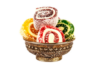 Heap of colorful Turkish delight isolated on white background. Turkish sweets isolated on white background. Ramadan.