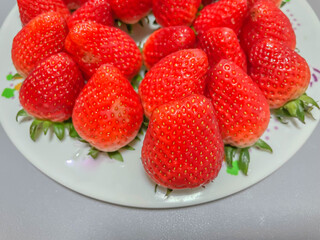 Closeup of fresh vivid red strawberry, fruit for healthy eating and diet