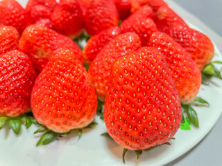 Closeup of fresh vivid red strawberry, fruit for healthy eating and diet