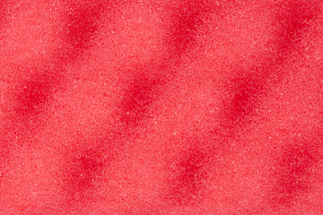 Red sponge textured background. Foam rubber background