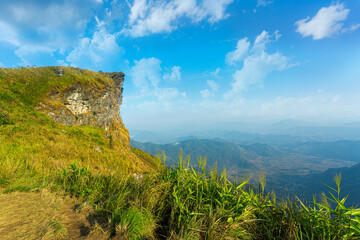 Chiang Rai, Thailand,Beautiful sunrise scene at high mountain with yellow clouds and blue sky, Phu chi fah Chiangrai Thailand