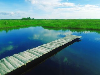 wooden bridge over lake