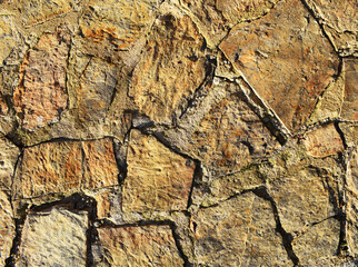 High resolution chipped and rough stone wall background.