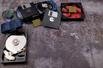Composition of various computer components on a dark background similar to cement, different...