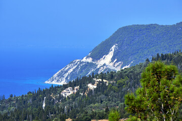 The seaside cliff covered with pine forest on the island of Lefkada