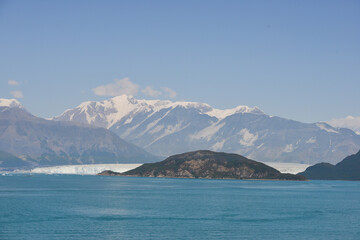 Landscape view of the ocean and snow-capped mountains of Alaska US.