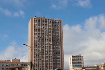 Fototapeta premium Genova, Italy-January 29, 2022: Beautiful modern high-rise buildings against the sky. 3d illustration on the theme of business success and technology. clouds reflection on the mirror.Industrial zone.