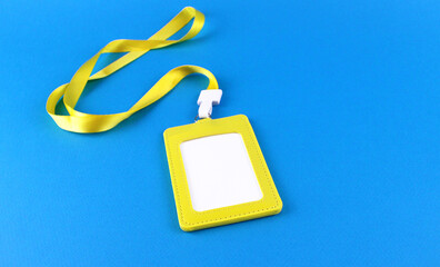 Yellow case with white blank badge on blue background