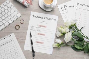 Flat lay composition with Wedding Checklist on wooden table