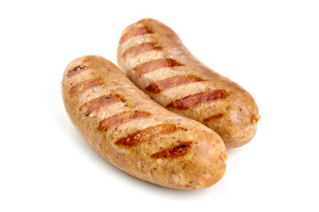 Grilled Munich sausages with green lettuce, isolated on white background.