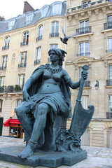 Paris. France. 16 October 2020. Bronze green sculpture woman warrior near the parisian museum.
