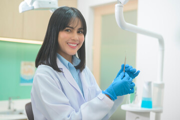 Portrait of female dentist working in dental clinic, teeth check-up and Healthy teeth concept