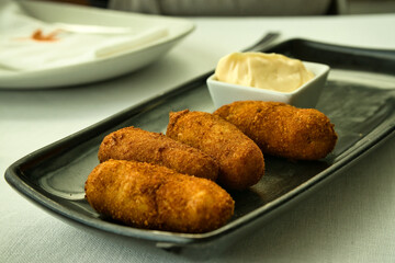 Delicious croquettes, spanish cover.
