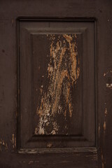 Old boards with peeling dark brown paint
