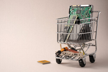Trolley from supermarket filled with computer components.