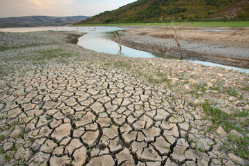 Empty river. Drought land texture, summers dry, cracked soil, ground on the field, blurred cracked...